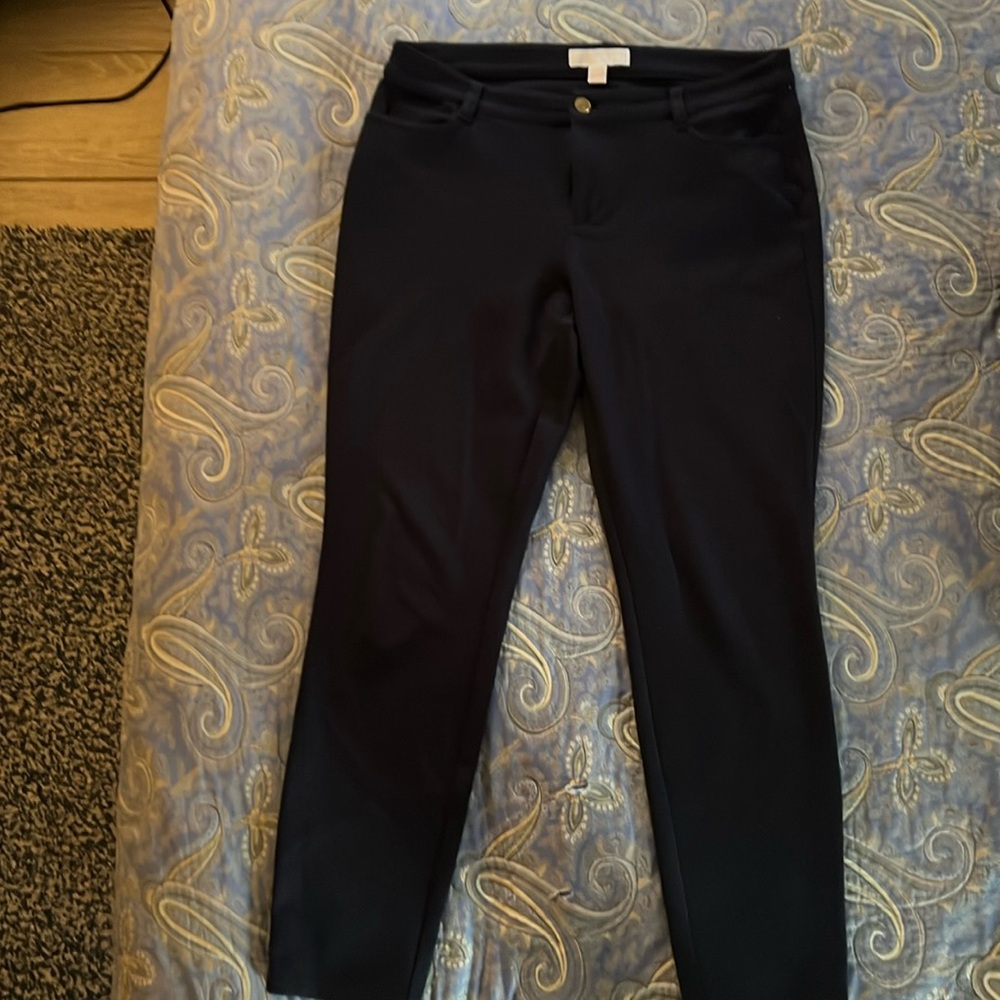 Michael Kors Navy Pants fabric has stretch. From a smoke free, pet free home.